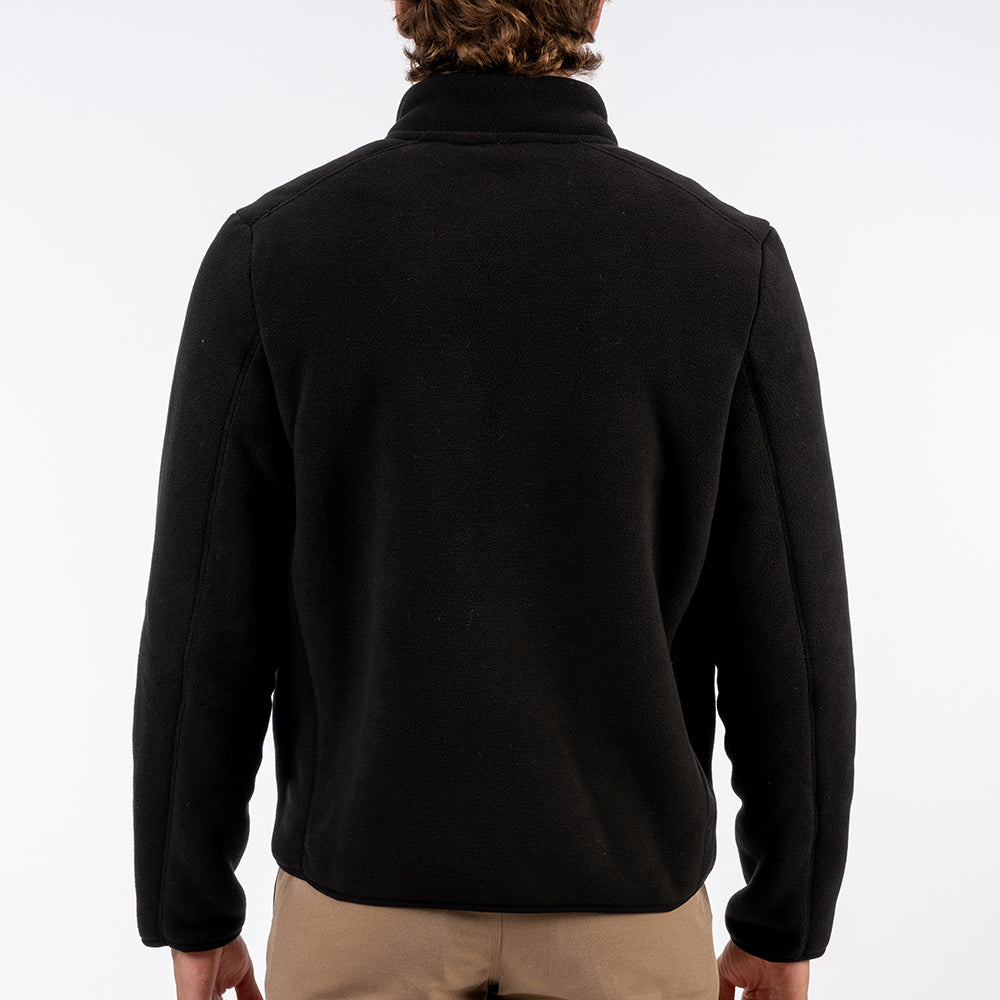 Person wearing a black jacket on a white background