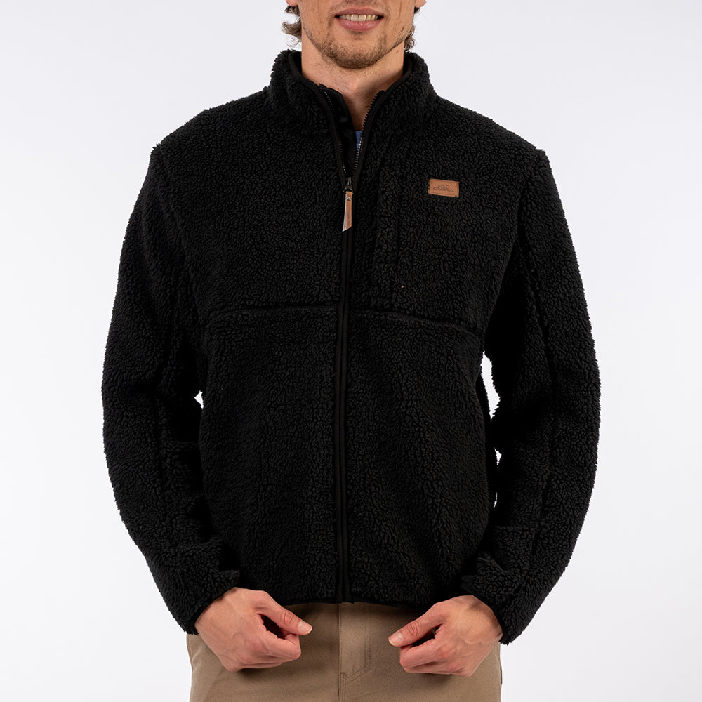 Man wearing a black fleece jacket on a white background