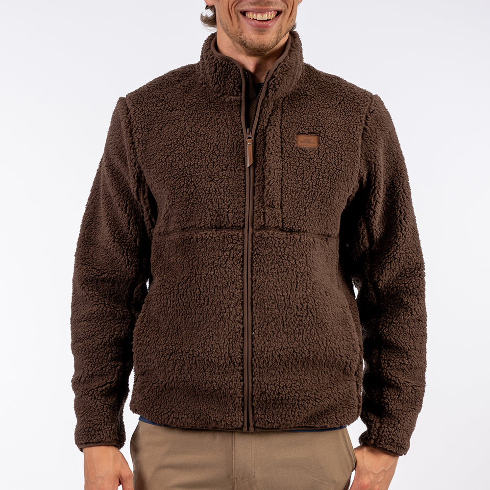 Man wearing a brown fleece jacket on a white background