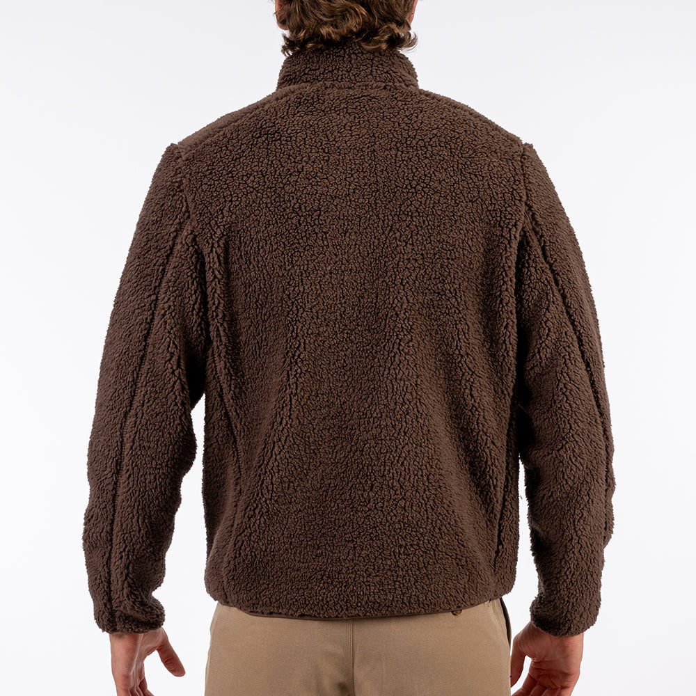 Brown fleece jacket worn by a person on a white background