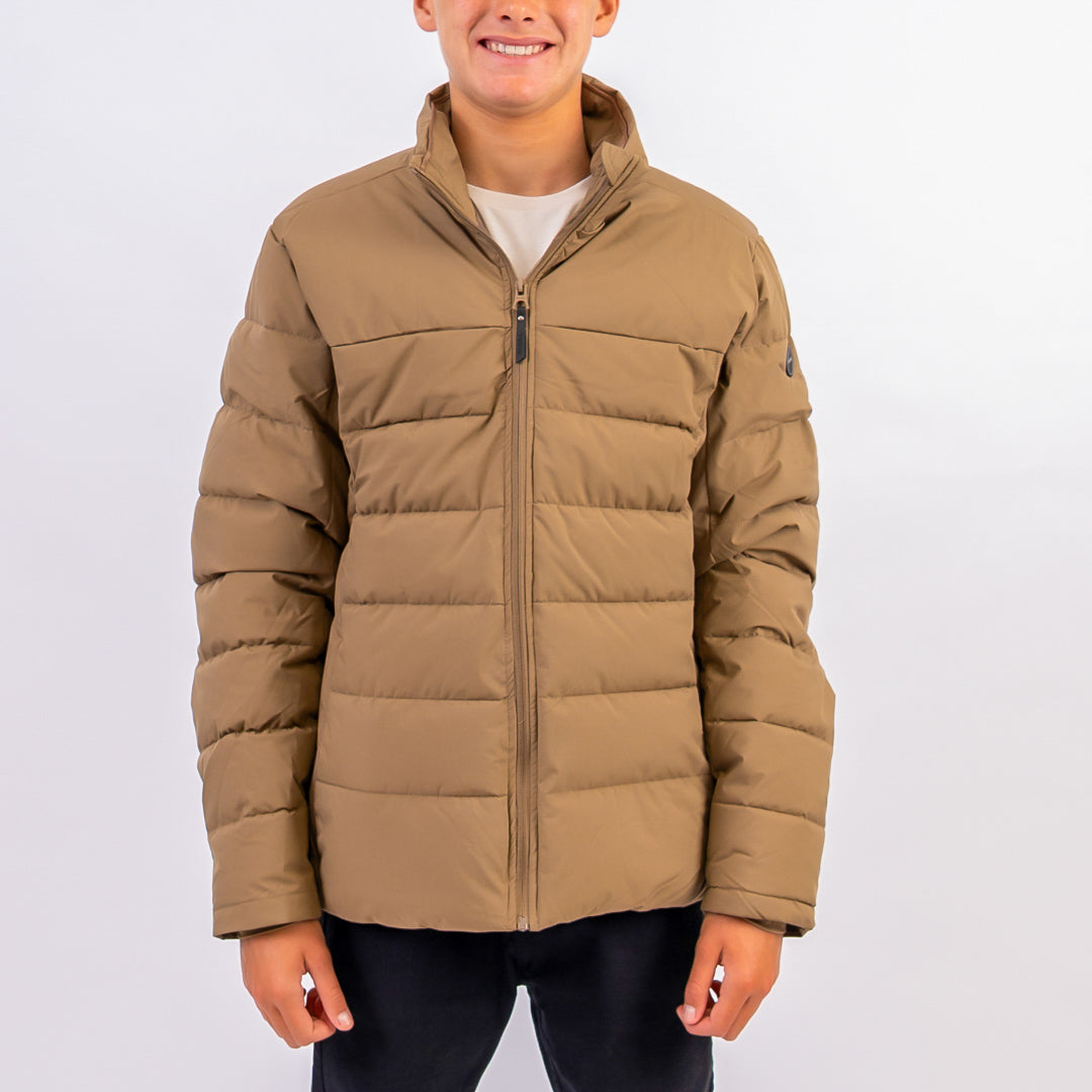 Person wearing a brown puffer jacket on a white background