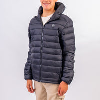 Person wearing a dark blue puffer jacket on a white background
