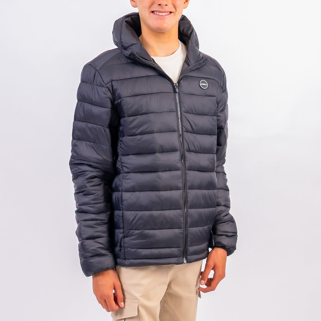 Person wearing a dark blue puffer jacket on a white background