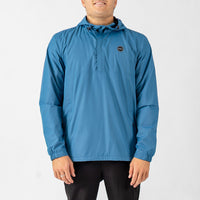 Person wearing a blue raincoat on a white background