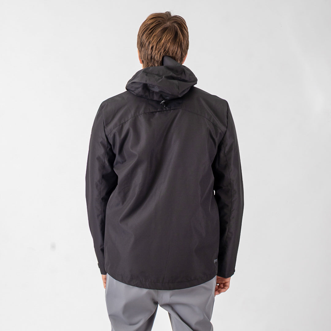 Person wearing a black jacket on a white background