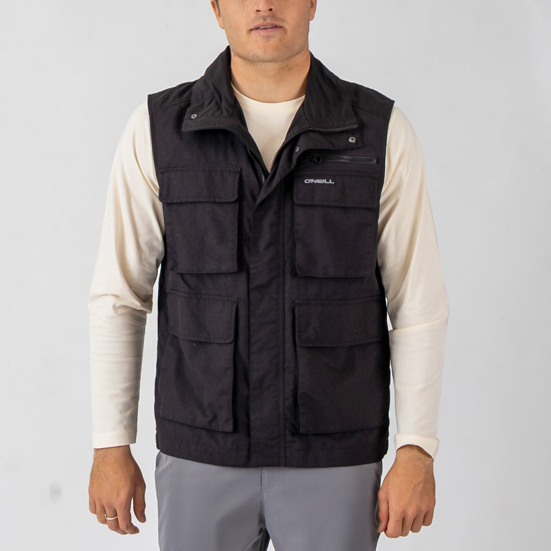 Person wearing a black O'Neill vest on a light gray background