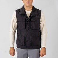 Person wearing a black O'Neill vest on a light gray background