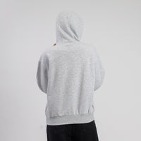 Person wearing a gray hoodie on a light gray background