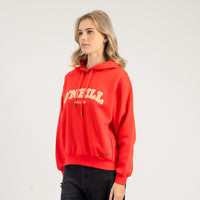 Person wearing a red hoodie with a brand logo on a plain background