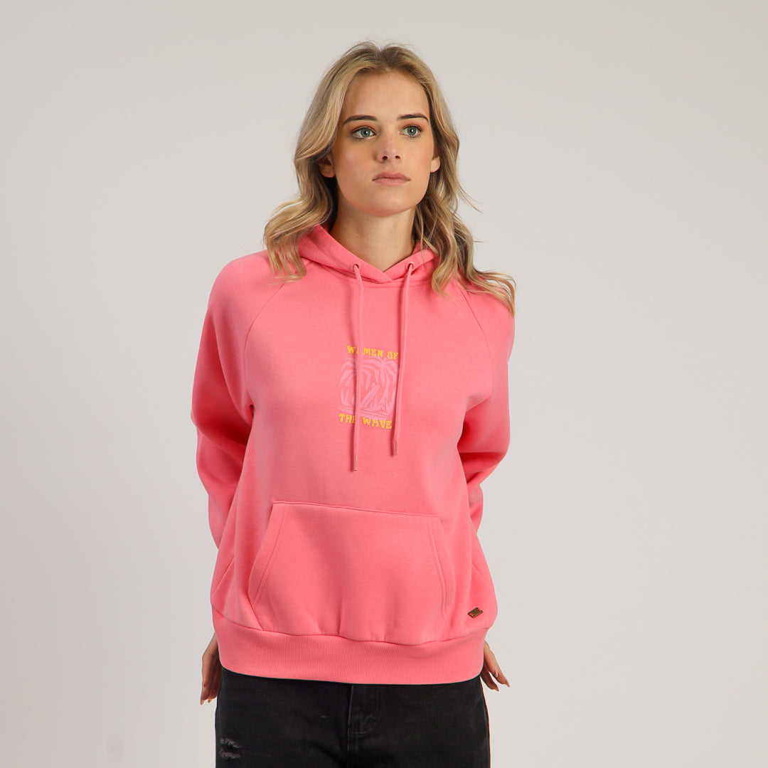 Woman wearing a pink hoodie with a logo on a light gray background