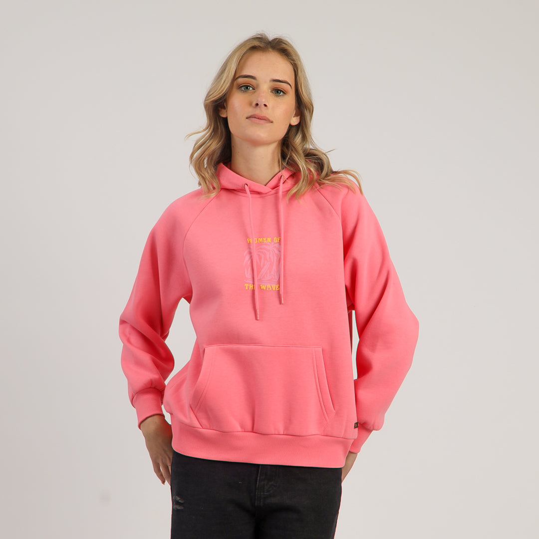 Person wearing a pink hoodie with yellow text on a plain background
