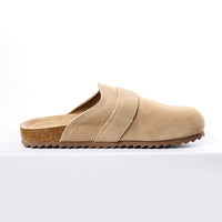 Beige slipper with cork sole on a white background