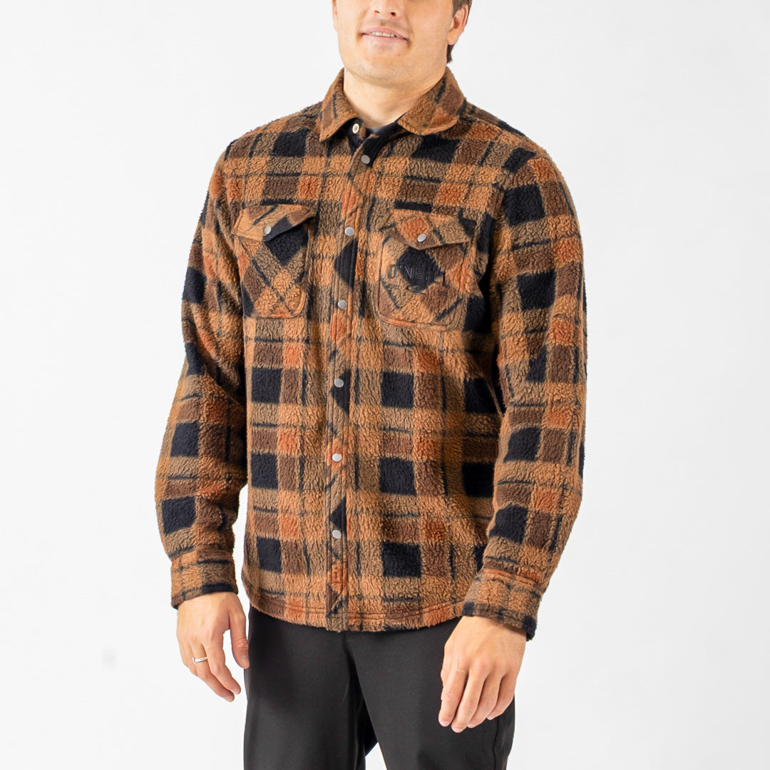 Man wearing a plaid shirt with a white background