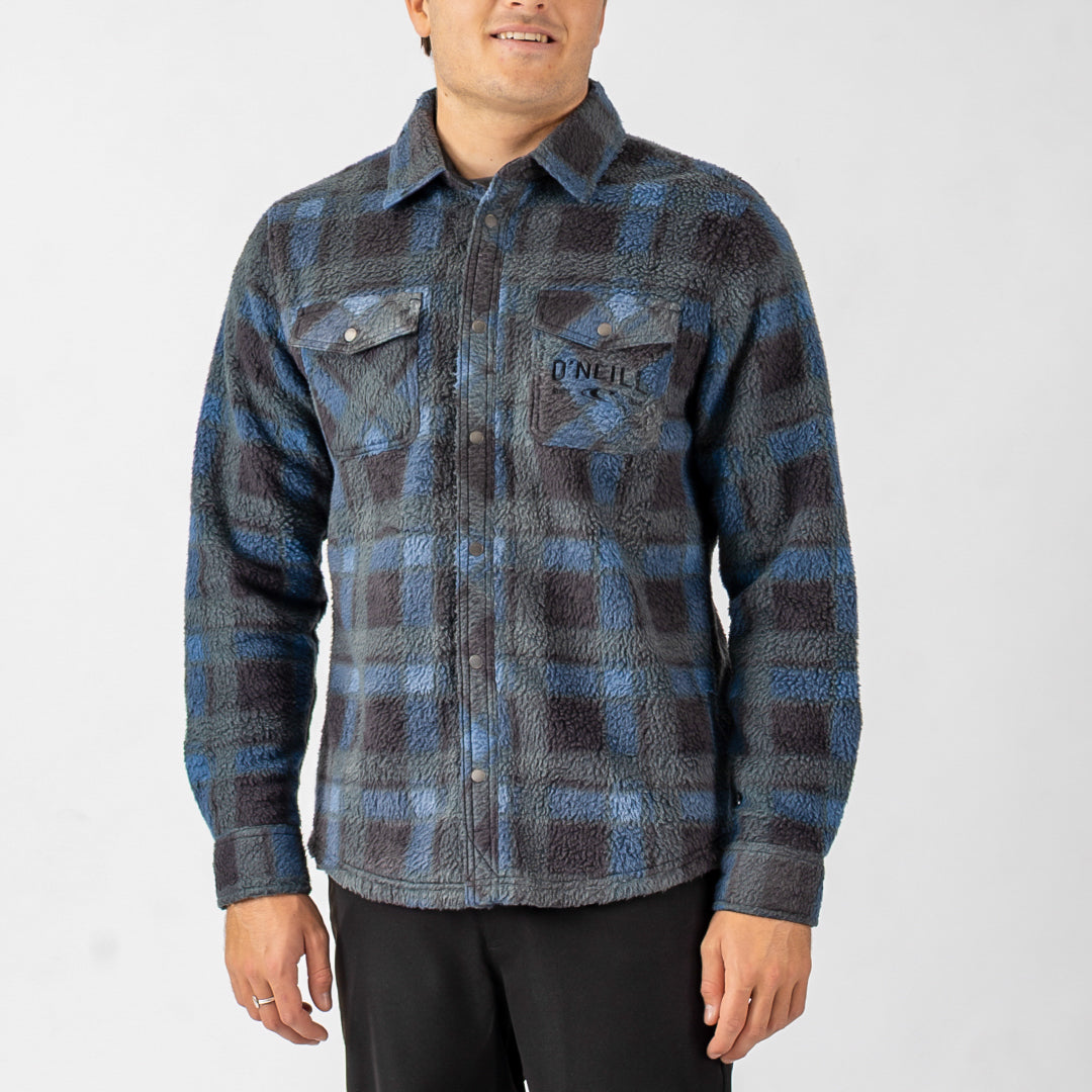 Person wearing a blue and gray plaid shirt with 'O'Neill' logo on a white background