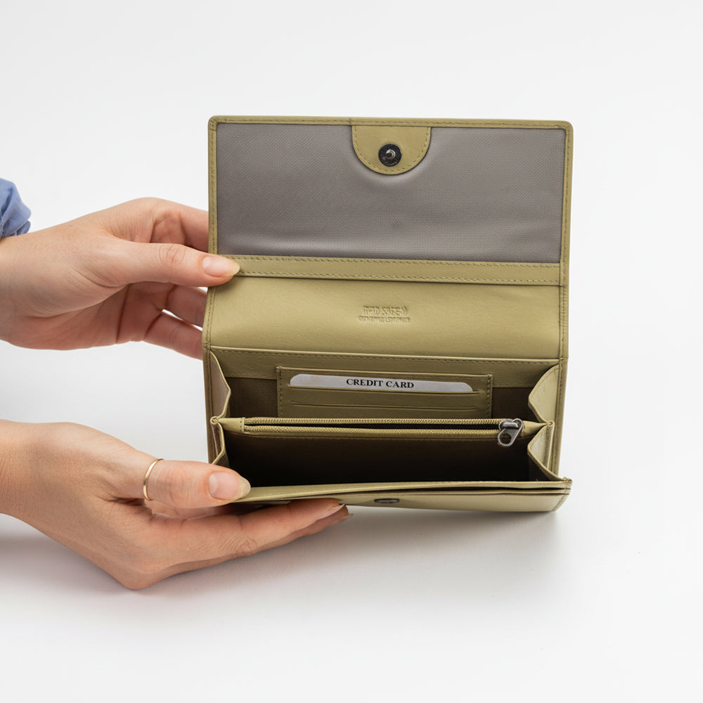 Beige wallet held open by a hand on a white background