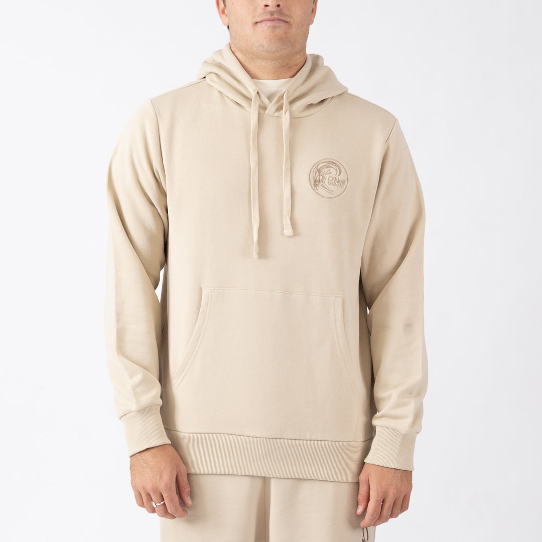 Person wearing a beige hoodie with a logo on a white background
