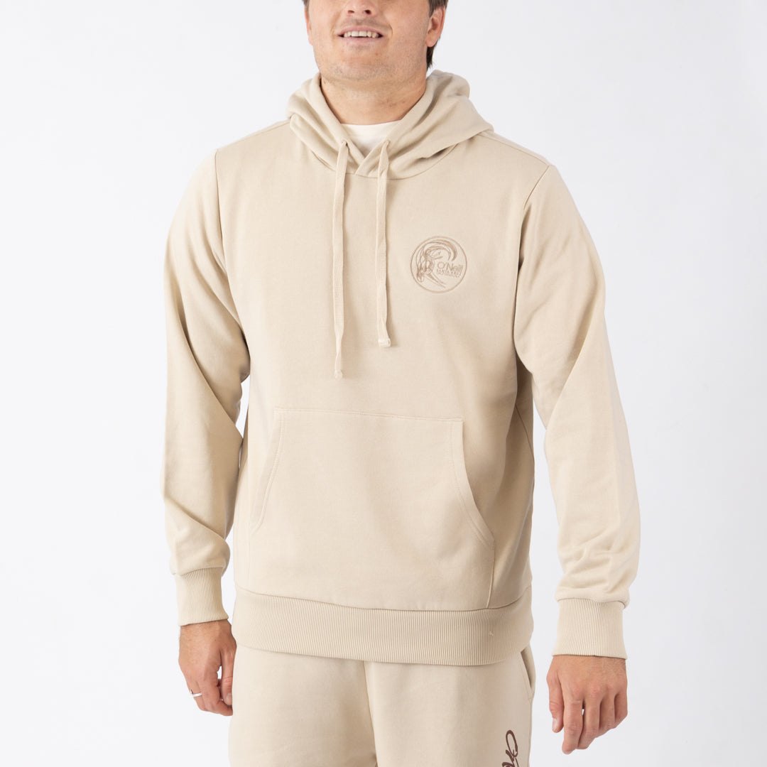 Person wearing a beige hoodie with a logo on a white background