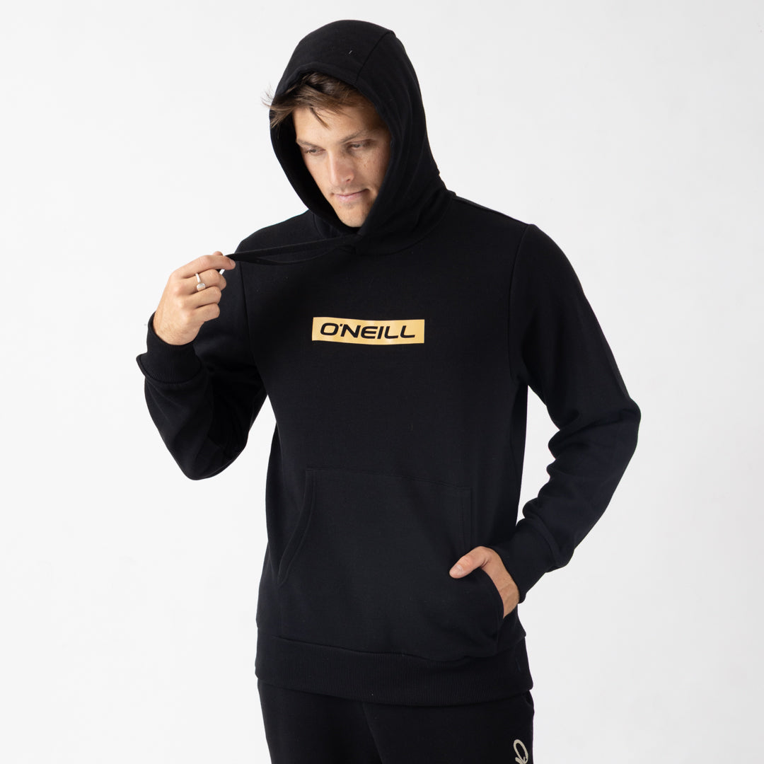 Person wearing a black hoodie with a yellow logo on a white background