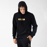 Person wearing a black hoodie with a yellow 'O'Neill' logo on a white background