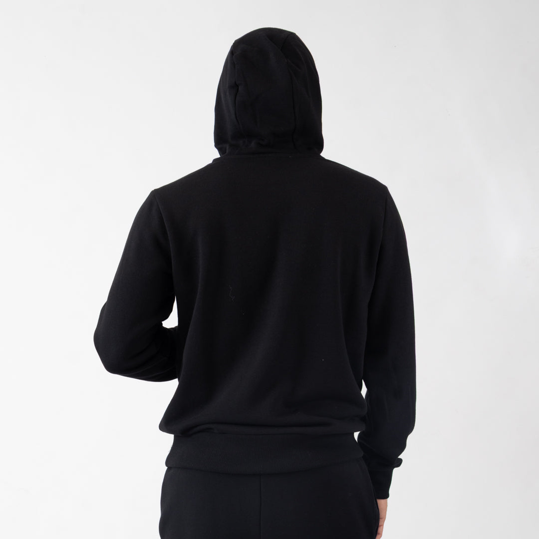 Person wearing a black hoodie from behind on a white background