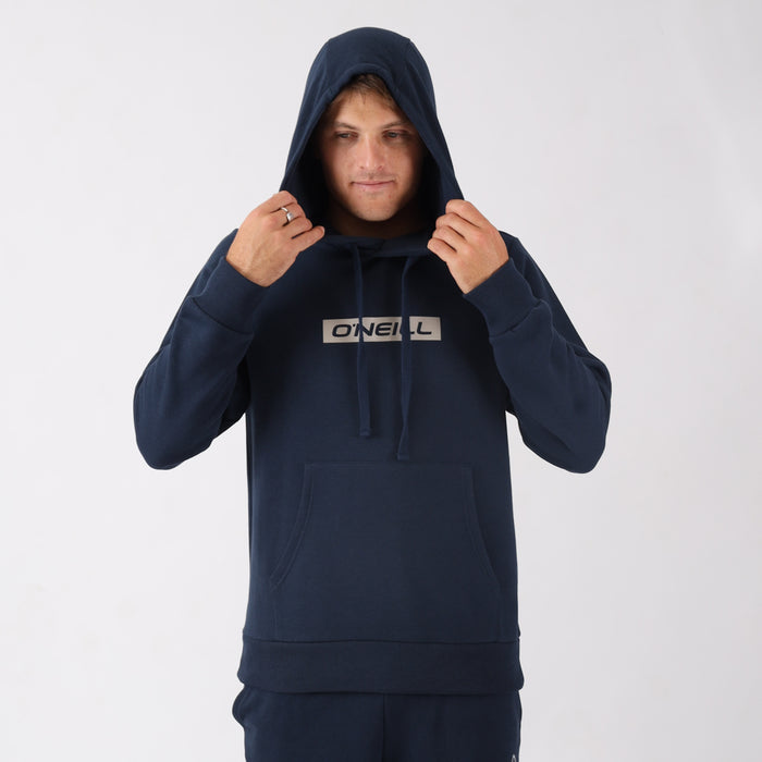 Person wearing a navy blue hoodie with a brand logo on a white background