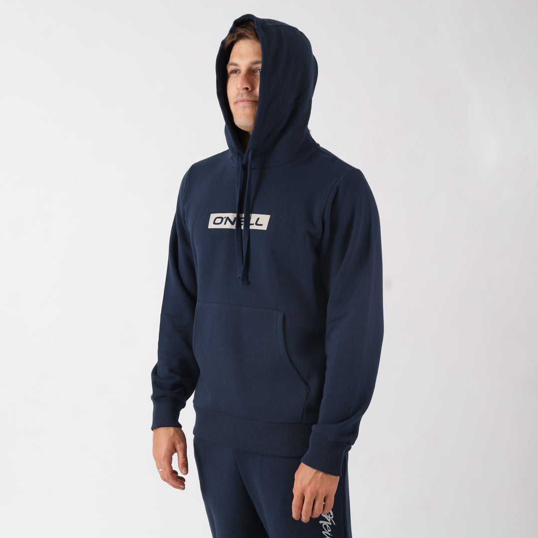Person wearing a navy hoodie with a brand logo on a white background