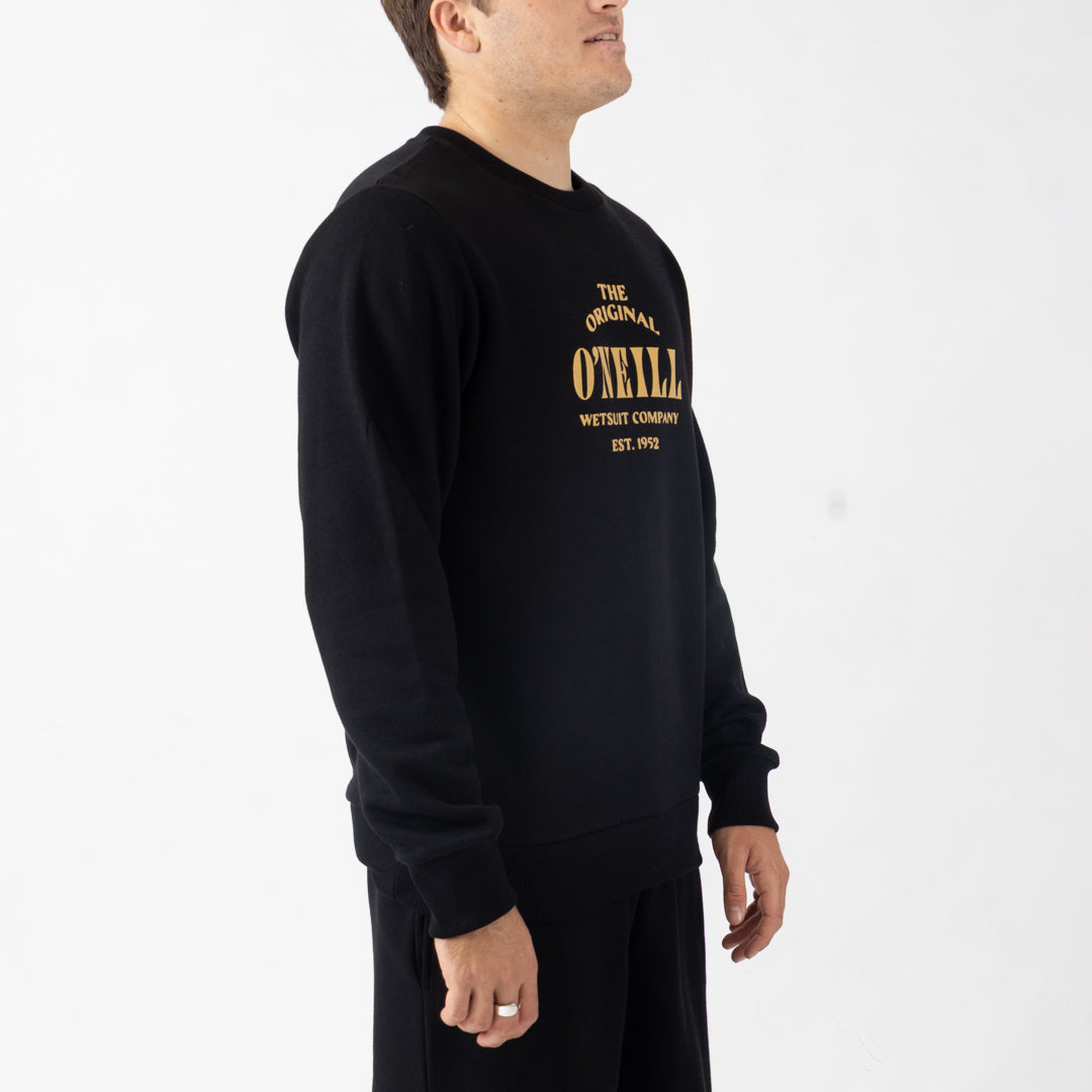 Person wearing a black sweatshirt with yellow text on a white background