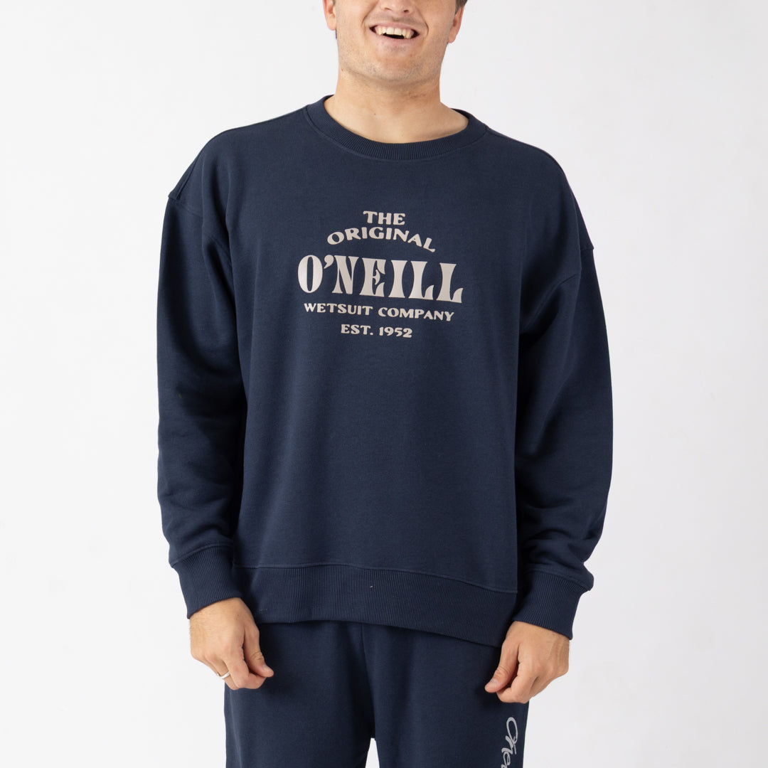 Person wearing a navy blue O'Neill sweatshirt with white text on a white background