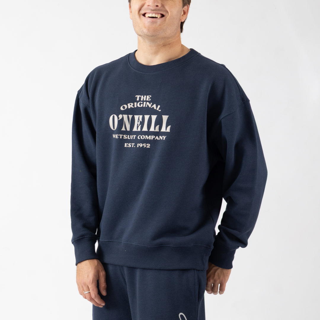 Person wearing a navy blue O'Neill sweatshirt with white text on a white background