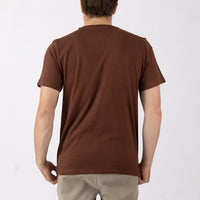Man wearing a brown t-shirt on a white background