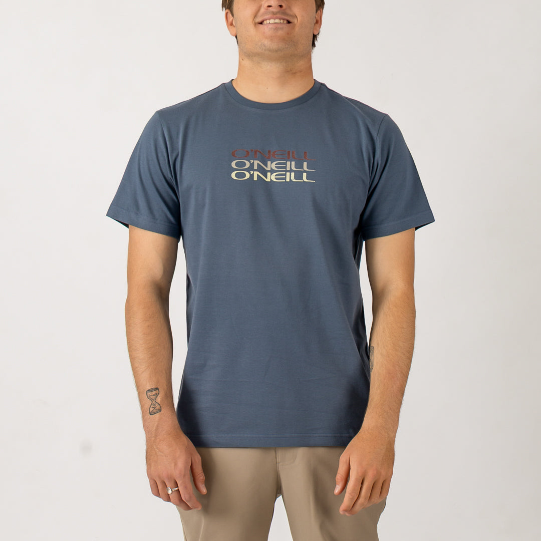 Man wearing a blue t-shirt with 'O'Neill' logo on a white background