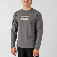Man wearing a gray long-sleeve shirt with a brand logo on a light gray background