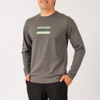 Man wearing a gray long-sleeve shirt with a logo on a white background