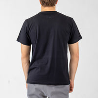 Person wearing a black t-shirt on a plain background