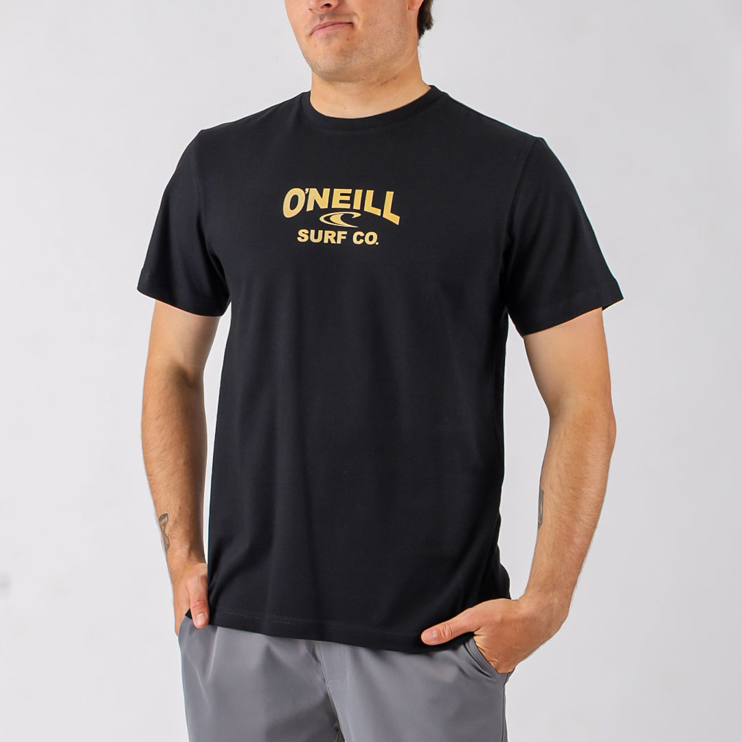 Person wearing a black O'Neill surf shirt with yellow logo on a gray background