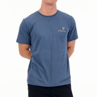 Person wearing a blue t-shirt with a logo on a white background
