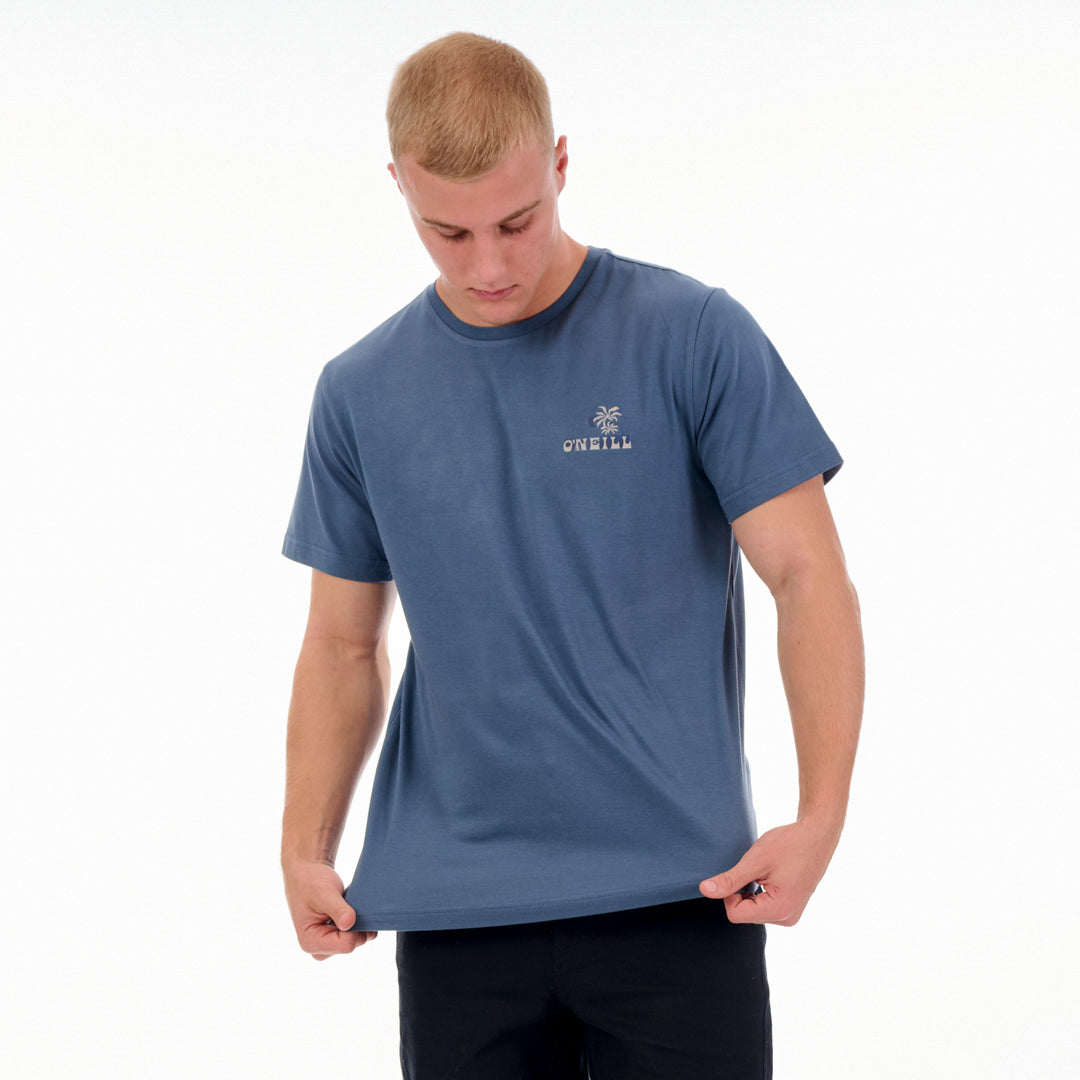 Man wearing a blue t-shirt with a logo on a white background