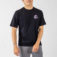 Person wearing a black t-shirt with a logo on a white background
