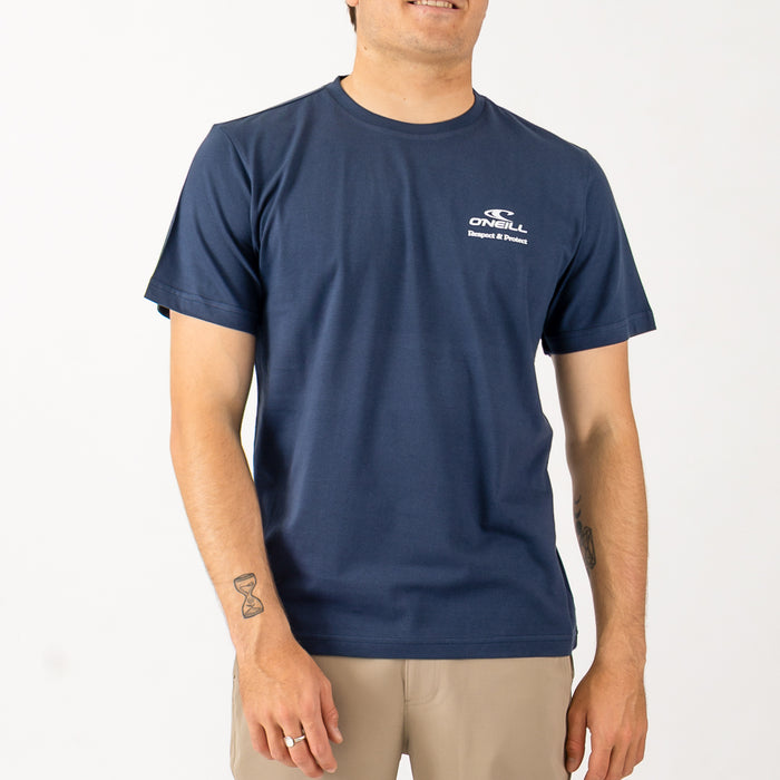 Man wearing a navy blue t-shirt with a logo on a white background