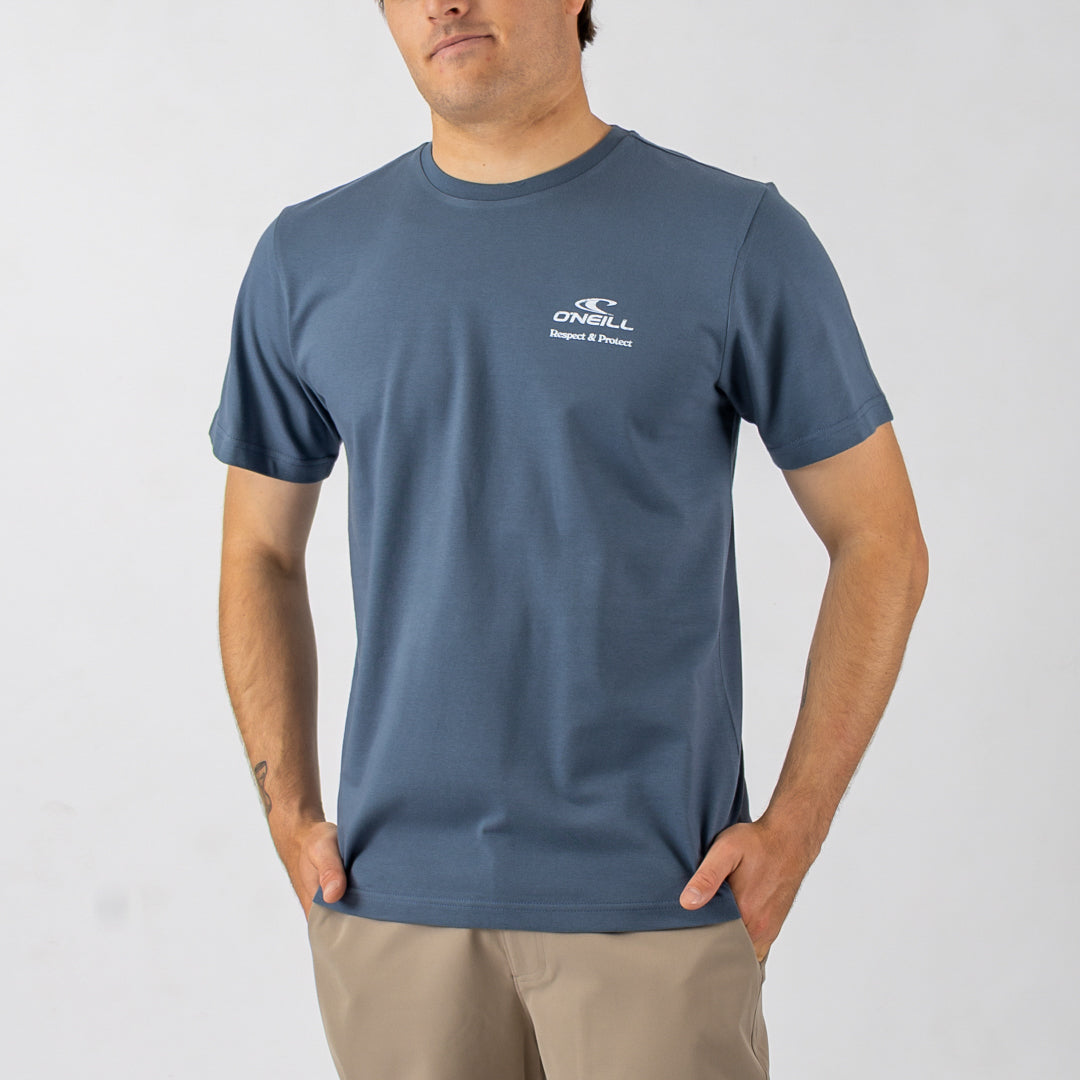 Man wearing a blue t-shirt with a logo on a white background