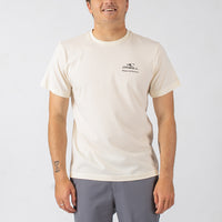 Man wearing a beige t-shirt with a logo on a white background