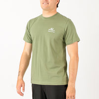 Man wearing a green t-shirt with a logo on a white background