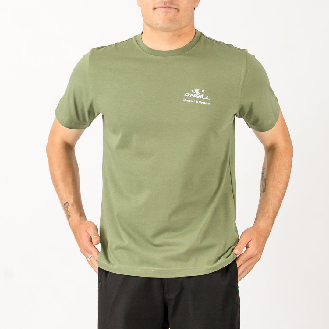 Person wearing a green t-shirt with a brand logo on a white background