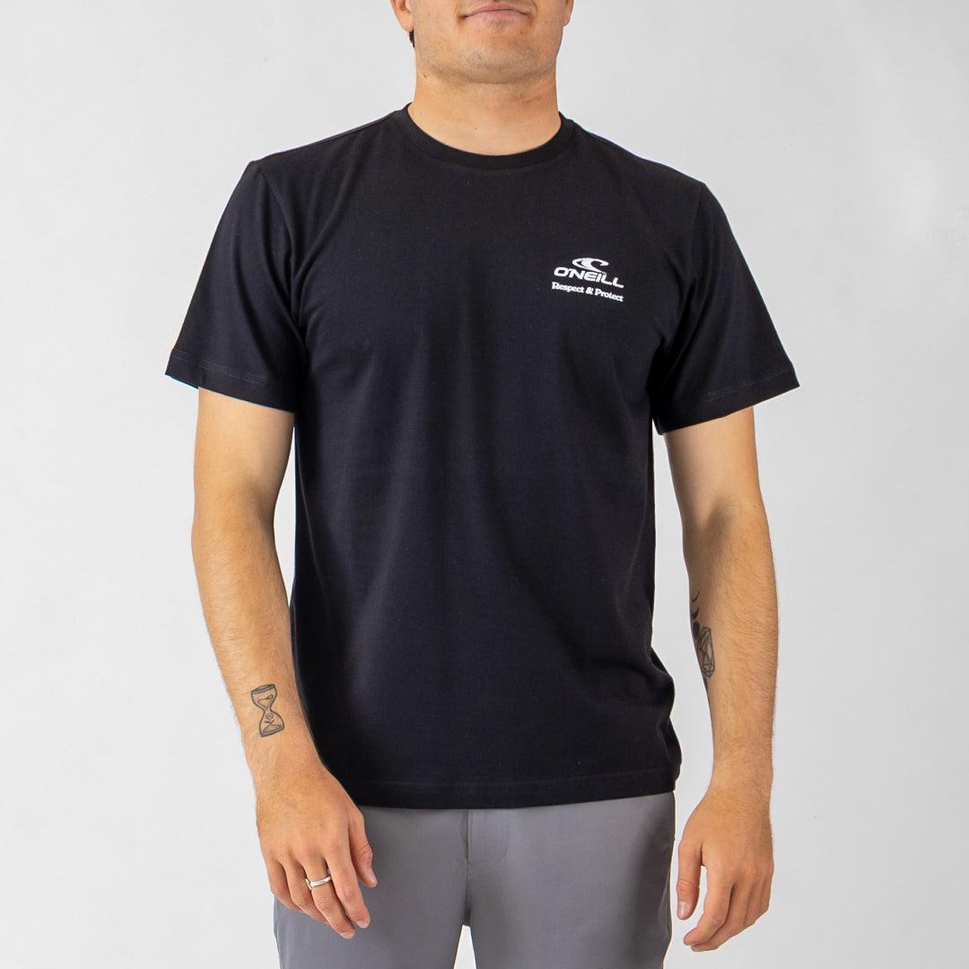 Person wearing a black t-shirt with a logo on a gray background