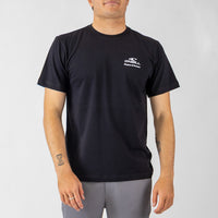 Person wearing a black t-shirt with a logo on a gray background