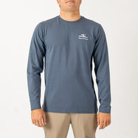 Man wearing a blue long-sleeve shirt with a brand logo on a white background