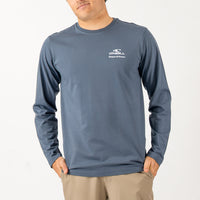 Man wearing a blue long-sleeve shirt with a brand logo on a white background