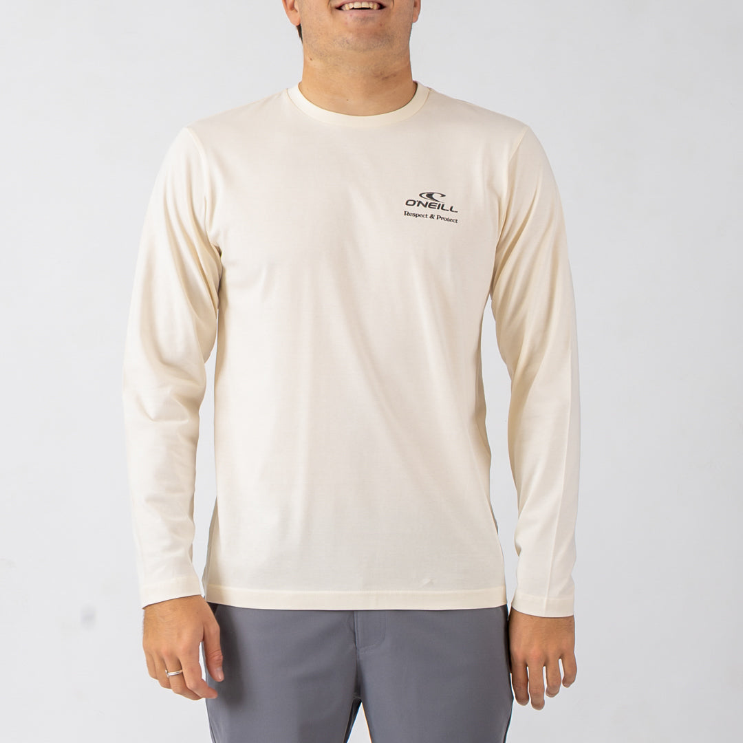 Person wearing a beige long-sleeve shirt with a logo on a white background