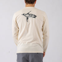 Person wearing a beige long-sleeve shirt with a turtle design on the back against a white background