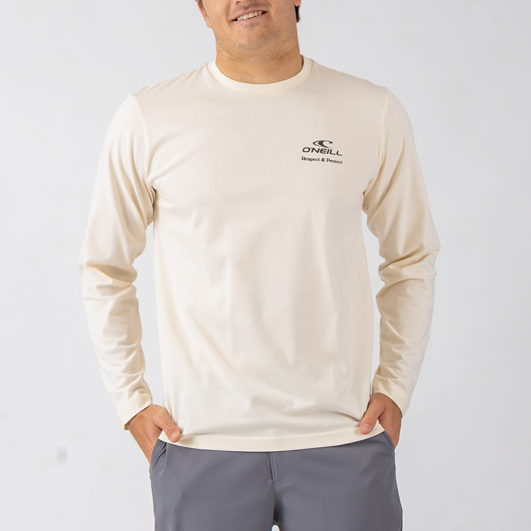 Man wearing a beige long-sleeve shirt with a logo on a white background